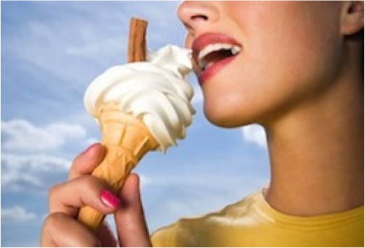 woman eating vanilla ice cream cone