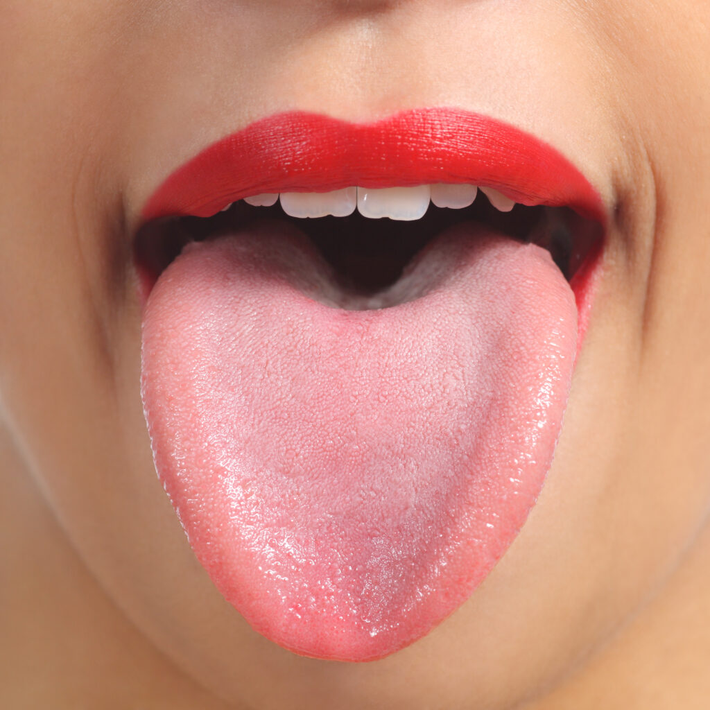 Woman's Tongue Sticking Out Ready to Brush