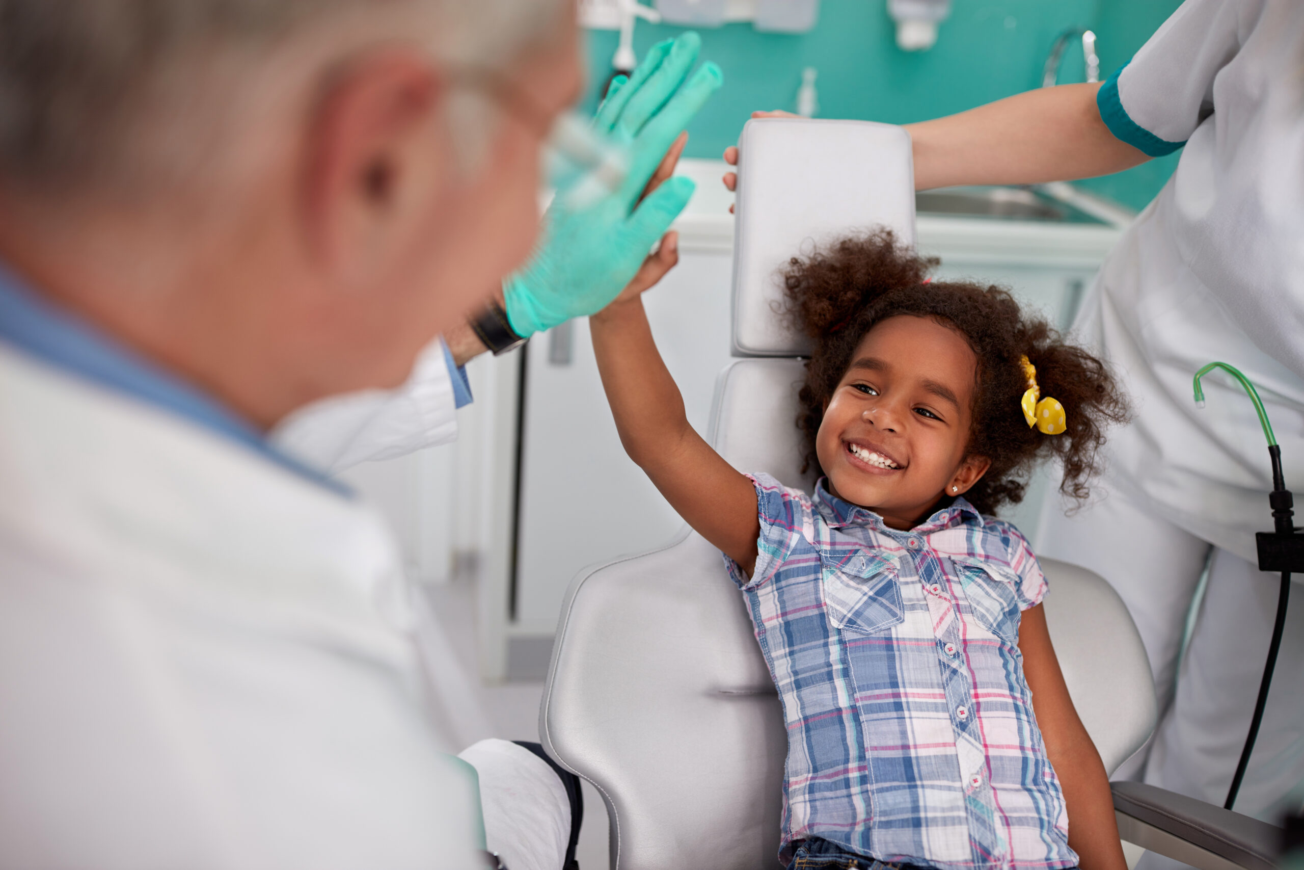 little girl smiling at her dentist